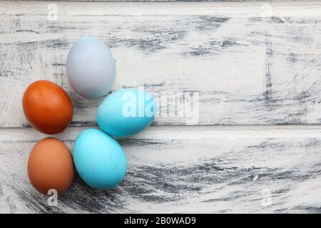 Blue Easter eggs on white painted wooden table background. design template, copy space. colorful easter eggs. Easter holiday concept, eggs pattern Stock Photo