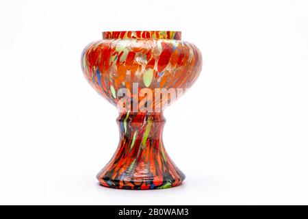 A colourful hand painted vase (with lots of Orange and other colours) on a plain white background with copy space. Stock Photo