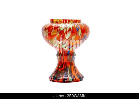 A colourful hand painted vase (with lots of Orange and other colours) on a plain white background with copy space. Stock Photo