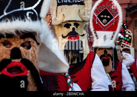 People from Stoletovo village in Bulgaria in traditional Kukeri costumes during holiday celebration Stock Photo