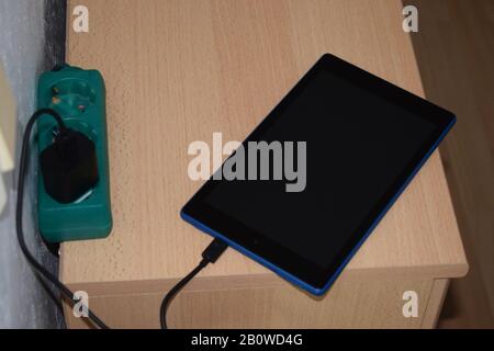 charging a tablet Stock Photo