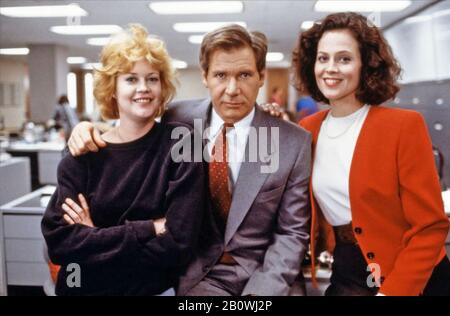 WORKING GIRL 1988 20th Century Fox film with from left: Melanie Griffith, Harrison Ford, Sigourney Weaver Stock Photo