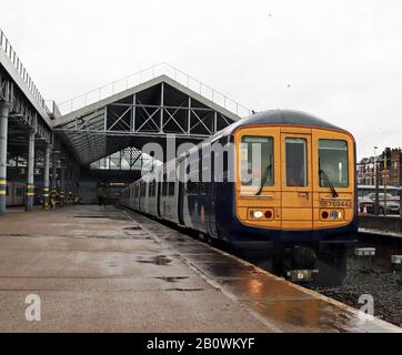 One of Northern’s “new” bi-mode trains stands in the rain at Southport during a test run from Southport to Wigan on 15.2.2020. Unit no 769 442. Stock Photo