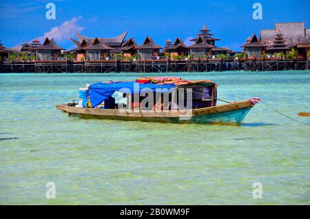 Ethnic minority of the Bajau sea nomads in traditional wooden boats (lepas), Celebes Lake, Malaysia, Southeast Asia Stock Photo