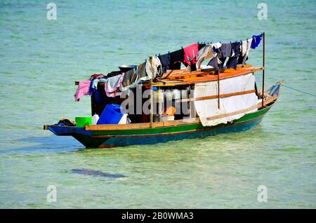 Ethnic minority of the Bajau sea nomads in traditional wooden boats (lepas), Celebes Lake, Malaysia, Southeast Asia Stock Photo