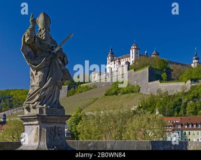 Saint Kilian on the old Main Bridge with Marienberg Fortress in Wuerzburg, Lower Franconia, Bavaria, Germany, Europe Stock Photo