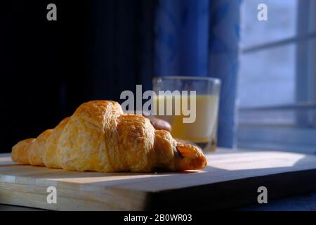 Close up of bakery food and milk on table  Stock Photo