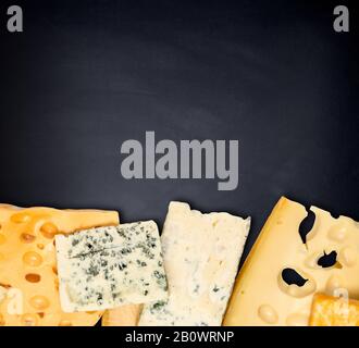 cheese slices isolated on  black background Stock Photo