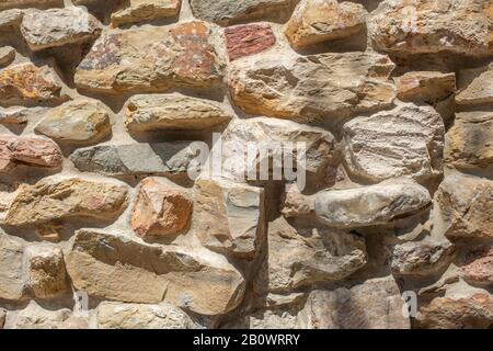 Laying of wild stone, texture of wild stone wall Stock Photo