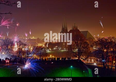 New Year's fireworks with cathedral and Severikirche in Erfurt, Thuringia, Germany Stock Photo