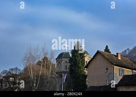 Orthodox church in Serbia with two crosses and two domes lit in the afternoon sun. Stock Photo