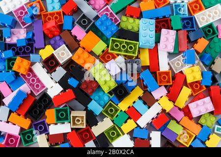 Close-up of a cluttered pile of colorful Lego bricks viewed from above. Top view. Stock Photo