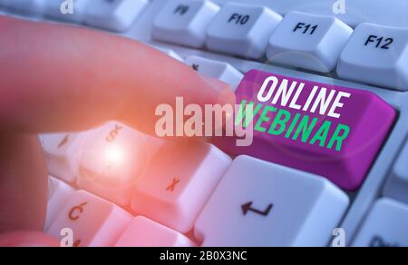 Conceptual hand writing showing Online Webinar. Concept meaning online meeting or presentation held via the Internet Stock Photo