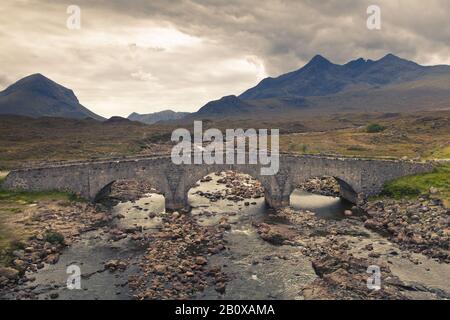 Old bridge over the river Sligachan before the Black Cuillin Hills, Isle of Skye, Scotland, Great Britain, Stock Photo