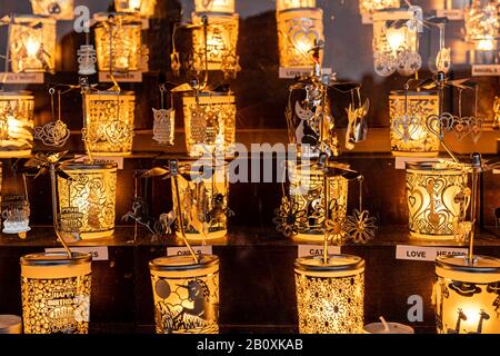 London, England, UK - January 3, 2020: Lighting glass candle holders with ornaments in kiosk at Christmas market Stock Photo