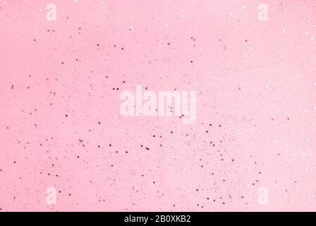 Pink background with small sparkles. Flat lay. Top view. Stock Photo