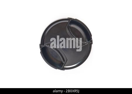 Black photo lens cap isolated on white background - top down view. Stock Photo
