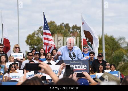 SANTA ANA, CALIFORNIA - 21 FEB 2020: Bernie Sanders Rally. Sanders at the podium surrounded by supporters at an outdoor rally. Stock Photo