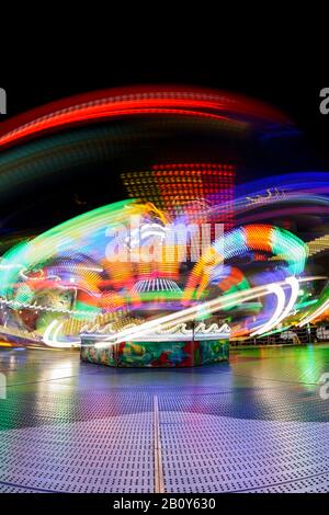 Dynamic light trails, Hamburg DOM, carousel, Hamburg, Germany Stock Photo