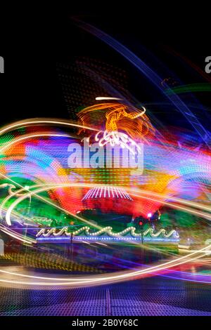 Dynamic light trails, Hamburg DOM, carousel, Hamburg, Germany Stock Photo