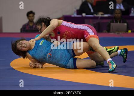 New Delhi. 21st Feb, 2020. Bolortungalag Zorigt (top) of Mongolia vies with Nabira Esenbaeva of Uzbekistan during the 65kg Women's Wrestling bronze medal match at the Asian Wrestling Championships 2020 in New Delhi, India, Feb. 21, 2020 Credit: Javed Dar/Xinhua/Alamy Live News Stock Photo