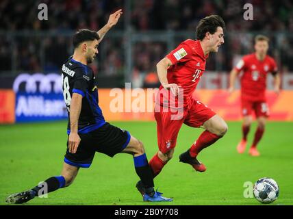 Munich, Germany. 21st Feb, 2020. Alvaro Odriozola (R) of Bayern Munich vies with Gerrit Holtmann of Paderborn during a German Bundesliga match between FC Bayern Munich and SC Paderborn 07 in Munich, Germany, Feb. 21, 2020. Credit: Philippe Ruiz/Xinhua/Alamy Live News Stock Photo