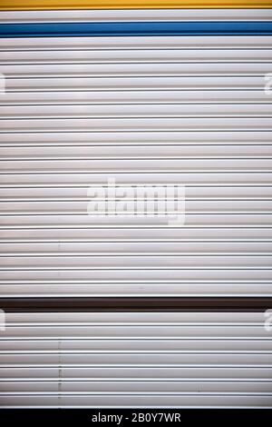 A closeup shot of a Steel Garage Door In an Industrial Area Stock Photo