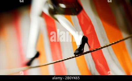 Doll on rope, shop window, tightrope walk, Hanseatic city Stock Photo