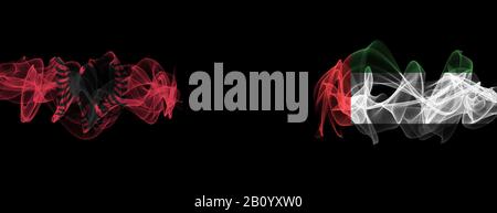 Flags of Albania and UAE on Black background, Albania vs United Arab Emirates Smoke Flags Stock Photo