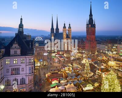 Christmas market with Marktkiche St. Marien and Roter Turm in Halle / Saale, Saxony-Anhalt, Germany