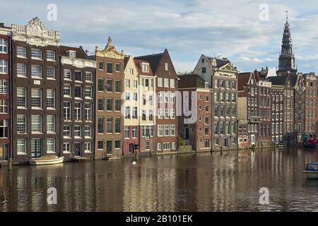 Houses at the Damrak with the Oude Kerk, Amsterdam, North Holland, Netherlands Stock Photo