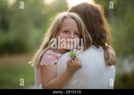 Father and daughter together in the forest Stock Photo