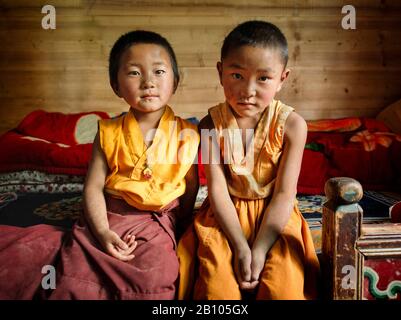 It is common for Tibetan families to send at least one of their children to live in monasteries to be trained as lamas and follow the religious path. Remote Tibetan plateau Stock Photo