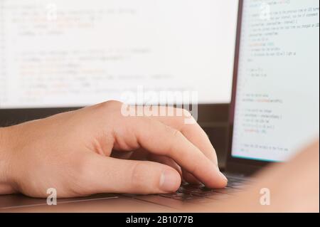 Computer engineer theme. Programmer work on script code Stock Photo