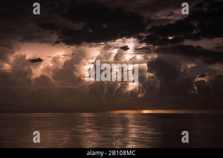 Distant flashes of earth in front of water pants over Lake Maracaibo (Catatumbo thunderstorm, the place with the highest lightning density on earth) Ologa, Zulia, Venezuela, South America Stock Photo