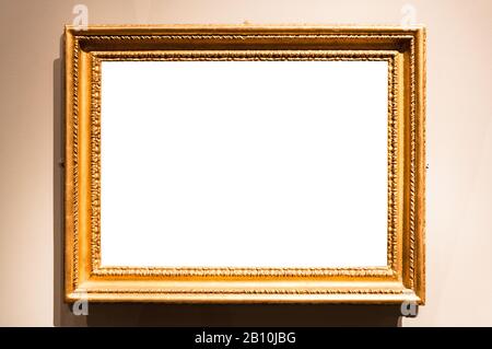 horizontal vintage painting frame with cutout canvas hangs on wall lit by electric light Stock Photo