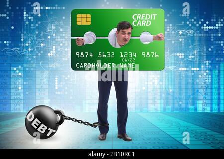The businessman in credit card burden concept in pillory Stock Photo