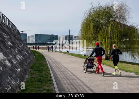 Jogging with a baby carriage, Spreeufer, government district, Mitte, Berlin, Germany Stock Photo