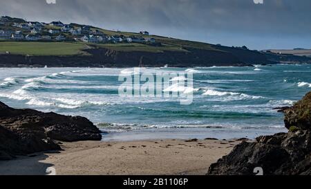 Baby Bay, Bayle Bay, and Baby Beach in New Polzeath, North Cornwall.  A storm in gathering and is preparing to strike as the tide comes in Stock Photo