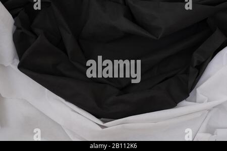Cloth waves close up the background, Stacked Creased fabric 3 color black red white, elegant wallpaper design, wavy folds of grunge silk texture satin Stock Photo