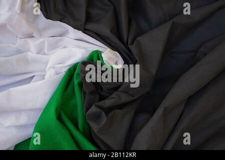 Cloth waves close up the background, Stacked Creased fabric 3 color black red white, elegant wallpaper design, wavy folds of grunge silk texture satin Stock Photo