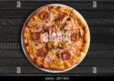 Overhead view of pizza on the table Stock Photo