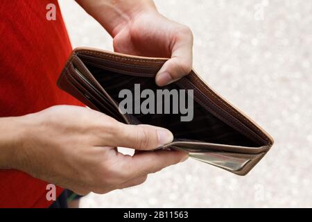 A Closeup hand man open an Empty Wallet. Stock Photo