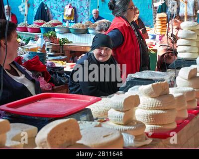 Vendors selling Sulguni brined Georgian cheese at the market in the city of Kutaisi the capital of the western region of Imereti in republic of Georgi Stock Photo