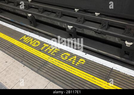 Warning sign on an underground track, London, UK Stock Photo