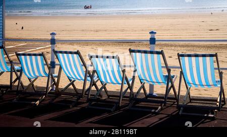 weymouth promenade deckchairs and beach on the dorset coast Stock Photo