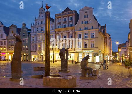 Houses on the Neuer Markt with Neptune Fountain in Rostock, Mecklenburg-West Pomerania, Germany Stock Photo