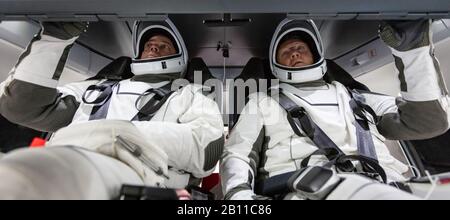 KENNEDY SPACE CENTER, USA - 30 Aug 2018 - NASA astronauts Doug Hurley and Bob Behnken familiarize themselves with SpaceX’s Crew Dragon, the spacecraft Stock Photo