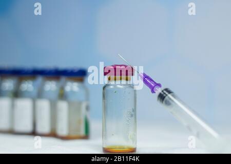 Close up vaccine vial needle dose flu vaccine drug syringe medical concept subcutaneous injection vaccination treatment care hospital disease Stock Photo