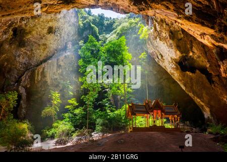 Phraya Nakhon Cave one of the most mystical and mysterious landmarks of Thailand. A gold and green Kuha Kharuehat 19th century pavilion is hidden deep inside a hard to reach cave located in the Khao Sam Roi Yot National Park in Prachuap Khiri Khan province.Thailand. Stock Photo